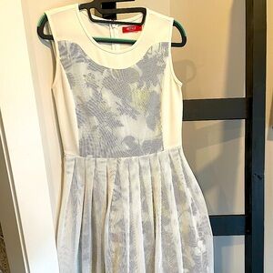 Super cute yet elegant Spring/Summer white dress. White mesh overlay. Size S.